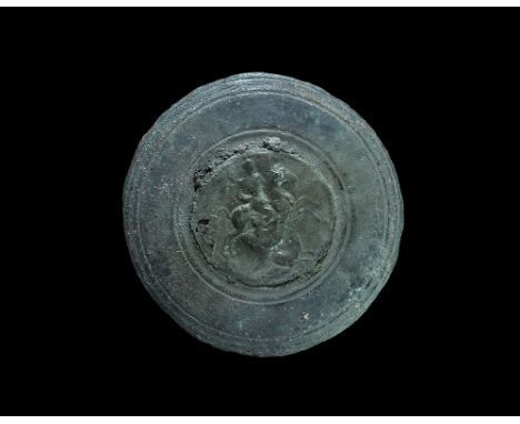  3rd-4th century AD. A slightly domed bronze discoid military phalera with incised concentric circles, applied central repous