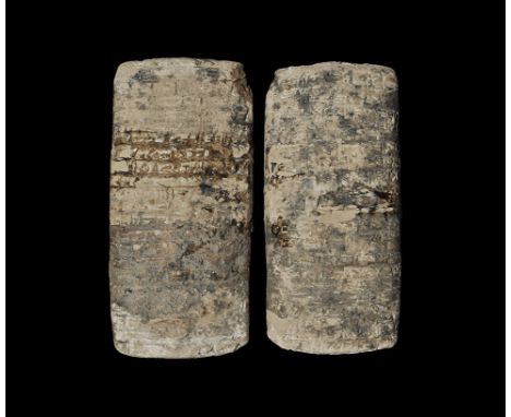  22nd-21st century BC. A ceramic double-faced pillow-shaped cuneiform tablet with economical text dealing with grain allocati