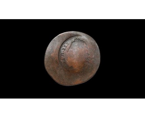  1771-1775 AD. First issue. A worn and flattened copper halfpenny bearing an incuse reversed impression of an obverse of a fa