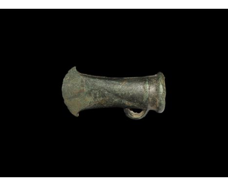  800-700 BC. A substantial cast socketted axehead with ribbed collar to the mouth, flared blade with convex cutting edge and 