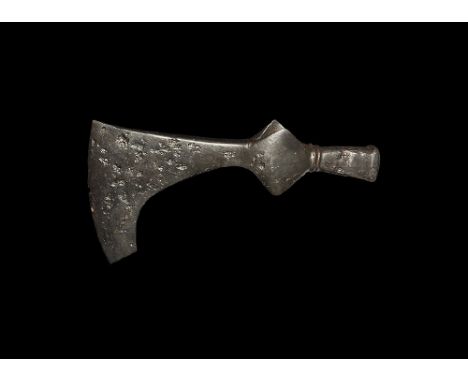  11th-12 century AD. A hand-forged iron axehead with square chin to the blade, lozenge plaques to the socket, rear square-sec