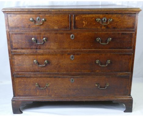 A Georgian oak cross branded two over three chest of drawers on bracket feet. Width 102cm x 82cm height x 51cm depth