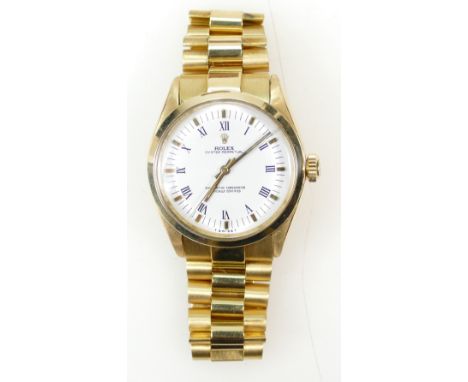 18ct Gold Rolex Oyster Perpetual chronograph Wristwatch and bracelet, circa 1990 model 14208, with service history, valuation