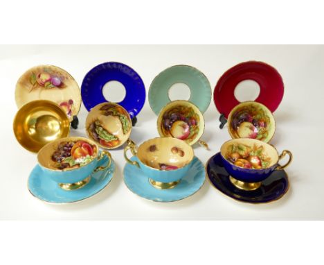 A collection of various Aynsley cups &amp; saucers decorated in the Orchard Gold fruit design (7)
