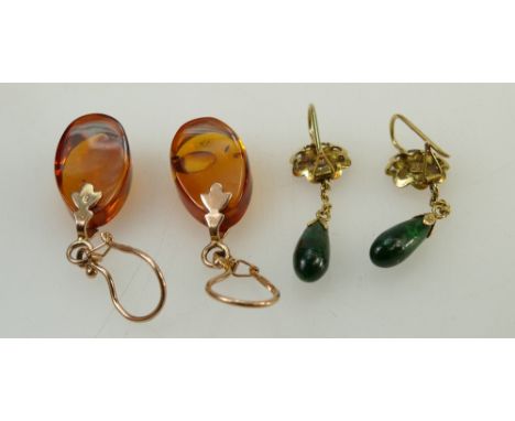 Two pairs of 14k gold earrings. Russian earrings set with amber (not known if synthetic or real) 44mm height, together with a