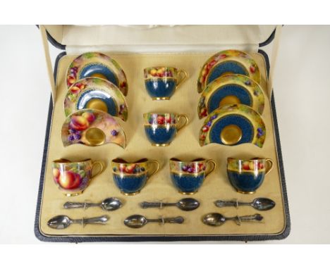 Royal Worcester boxed set of gilded coffee cans and saucers handpainted with fruit by various artists including E Townsend, W