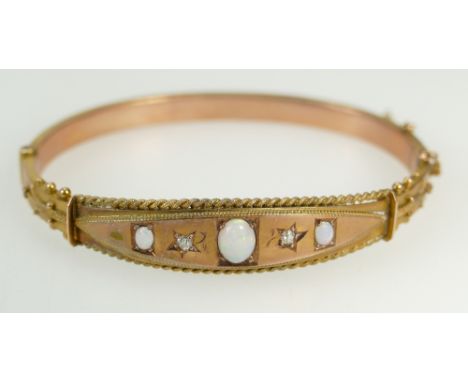 Victorian opal &amp; diamond bangle in original case, set in gold coloured metal, tested as 9ct or better.  Weight 8.6g. Inte