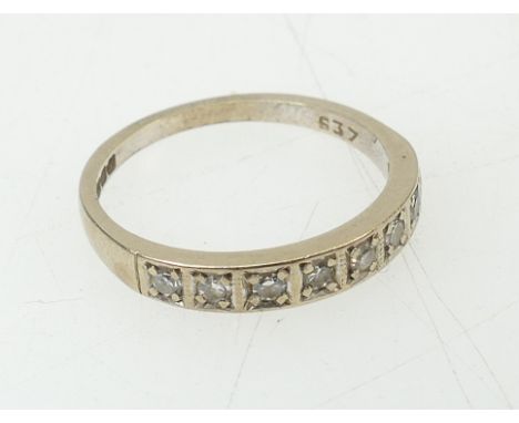 18ct hallmarked gold half eternity ring set 8 diamonds. Size N1/2. Stones about 5 points each, total 0.4ct appx. Weight 2.9g.