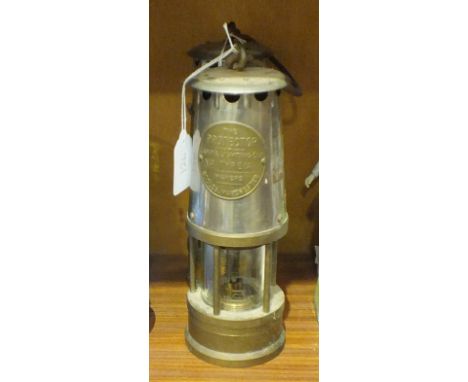 Two 'The Protector No. Type 1A' miner's lamps by the Lamp &amp; Lighting Co. Ltd, Eccles, Manchester, 26cm high, (2).