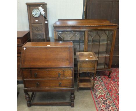 An oak display cabinet, 120cm wide, an oak bureau, a needlework table and an oak grandmother clock of square form, (no clock 