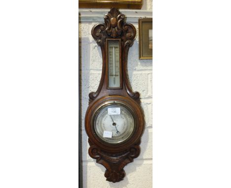 An oak-cased aneroid barometer/thermometer, the dial marked Adams, Dartmouth, 61cm, an oak three-bottle Tantalus (no key), tw