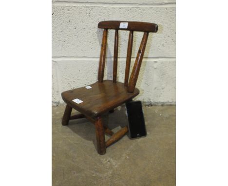 A child's elm stick-back chair, 41cm high.