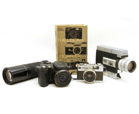 A large collection of cameras and lenses , to include a Leica Mini Elmar, 1:3.5/35, Canon zoom 518 Super 8 cine-camera, a Pen