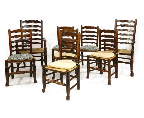 A set of eight oak and elm ladder back dining chairs, 18th century, with rush seats and straightened cabriole supports united