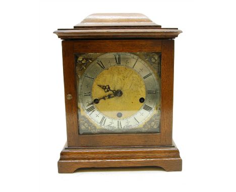 A 20 th Century oak cased Westminster chiming bracket clock, the dial inscribed ‘Marton &amp; Gain’, 32cm high
