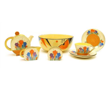 A Clarice Cliff for Wilkinson part tea set, 1930s comprising a teapot, 14cm high, a cup, three saucers, a milk jug and a suga