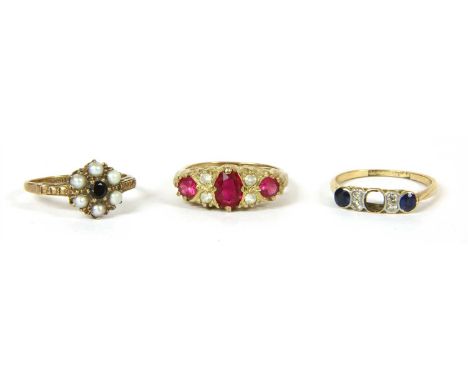 A gold sapphire and diamond seven stone ring, ( one sapphire deficient ), Swiss cut sapphires with a pair of single cut diamo