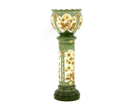 A late Victorian Burmantofts ‘faience’ jardinière and pedestal, moulded with sunflowers, moulded mark 1917, painted no. 74