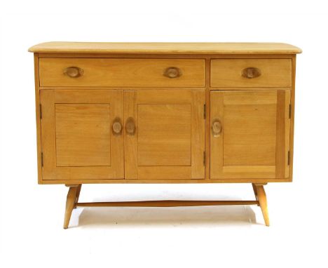 An Ercol mid century elm sideboard, the shaped top above two frieze drawers, with cupboards below on turned feet, 123cm wide,