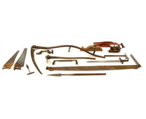 A collection of vintage tools, to include saws, planes, a brace a scythe, a short spear, a sword etc
