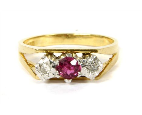 A gold ruby and diamond three stone ring, a circular mixed cut ruby six claw set to a rex collet, with a single cut diamond, 