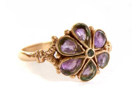 A rose gold amethyst flowerhead cluster ring, with pear cut amethysts, rub set to split shoulders and a D section shank, test