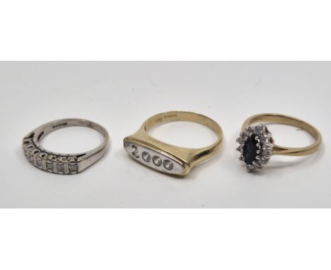 A 9ct. white gold seven stone half hoop diamond ring, set row of seven round brilliant cut diamonds (ETDW 0.25 carats), size 