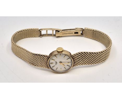 A 9ct. gold Longines ladies' bracelet watch,&nbsp;c.1975, manual movement, cal.410, having signed circular dial with gold bat