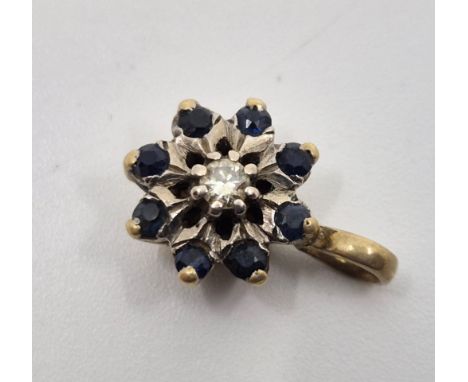 A yellow metal, sapphire and diamond pendant, set single round brilliant cut diamond to raised centre with border of eight ro
