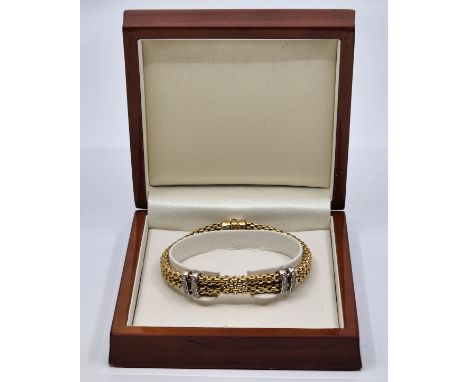 A Fope Italian 18ct. bi-colour gold and diamond set&nbsp; double Flex-it bracelet, fashioned from twin 18ct. gold yellow gold
