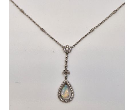 An Edwardian style 18ct. white gold, diamond and opal pendant necklace,&nbsp;having flower form cluster of nine collet set ro