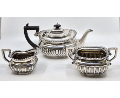 A matched silver three piece tea service, the teapot by George Nathan &amp; Ridley Hayes, Chester 1903, the twin handled suga