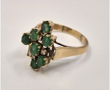 A yellow metal, diamond and green paste cluster ring,&nbsp;of geometric design, set arrangement of three eight-cut and four c