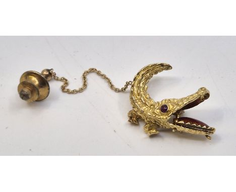 An 18ct gold "crocodile" tie pin,&nbsp;with cabochon ruby set eye and red guilloche enamel tongue, length 30mm. (gross weight