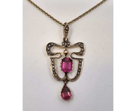 A 9ct. gold, pink paste and seed pearl pendant, suspended from a 9ct. gold cable chain, length 42cm. (total gross weight 4.8g