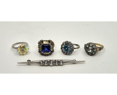 A white metal five stone bar brooch, set five graduated white gem stones (white metal assessed as platinum), length 67mm (gro