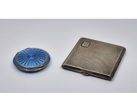 An Austrian silver and light blue guilloche enamel circular compact, impressed marks to interior, diameter 5cm, together with