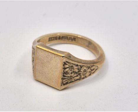 A 9ct. gold signet ring, with floral chased and engraved shoulders, size UK U-U 1/2. (9.0g)&nbsp;