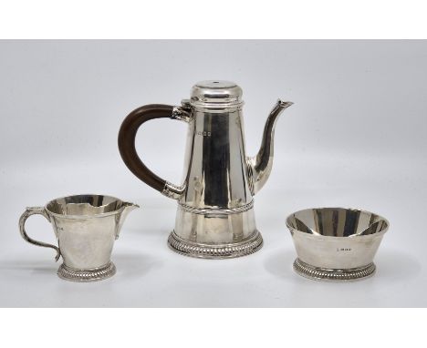 A silver three piece Batchelor's coffee service, by Wakeley &amp; Wheeler, London 1923, comprising coffee pot (lacking finial