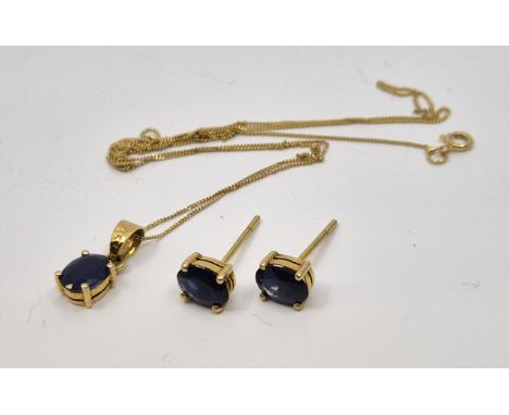 A 14ct gold and sapphire pendant, claw set mixed oval cut sapphire, suspended from fine 14ct. gold curb link chain, together 