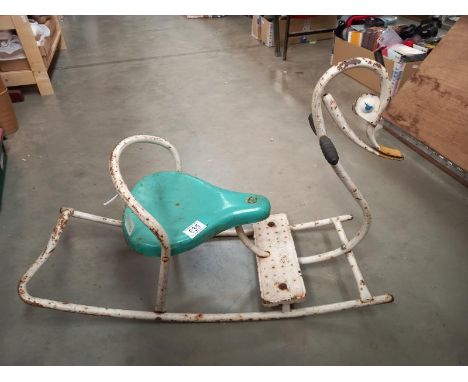 A vintage pressed steel Mobo toddler's rocking swan