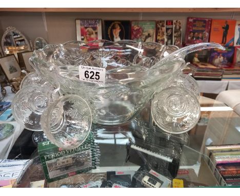 A vintage moulded glass punch bowl with ladle, hooks and 8 punch glasses