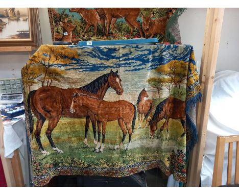 A large wall hanging tapestry wool work of horses
