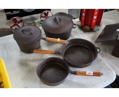 An 8" and a 12" heavy cast iron skillet, a 4½ quart Dutch oven and a 3 quart saucepan