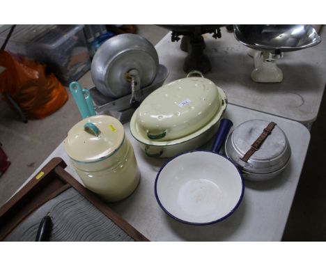 An enamel roasting tin, an enamel twin sectioned saucepan, an enamel handled bowl, camping plates etc.