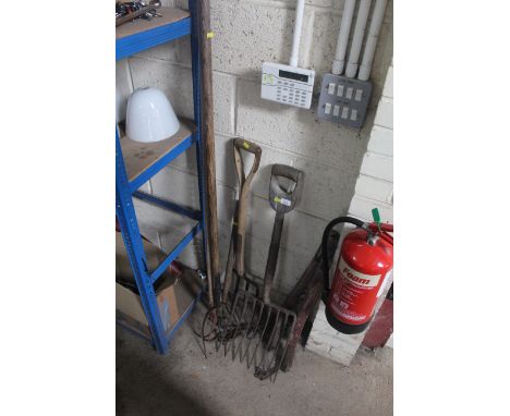 A quantity of long handled tools including forks, pitch fork and a pair of wooden hames 
