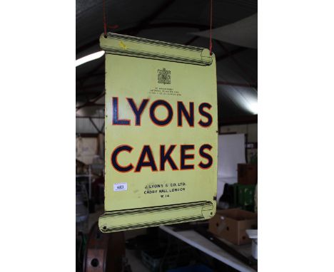 A double sided "Lyons Cakes" enamel advertising sign, with scroll effect to top and bottom, approx. 21&frac12;" x 15" in extr