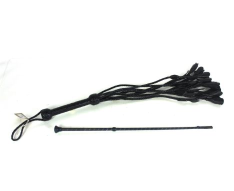 A modern riding crop and a leather flail whip 