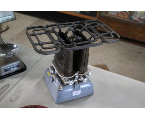 A Beatrice double burner stove with double pot stand and enamel cast iron base