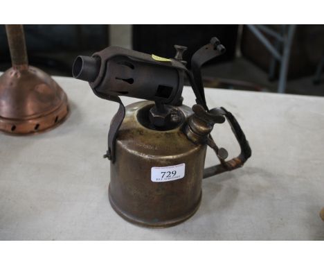 A large brass blow lamp